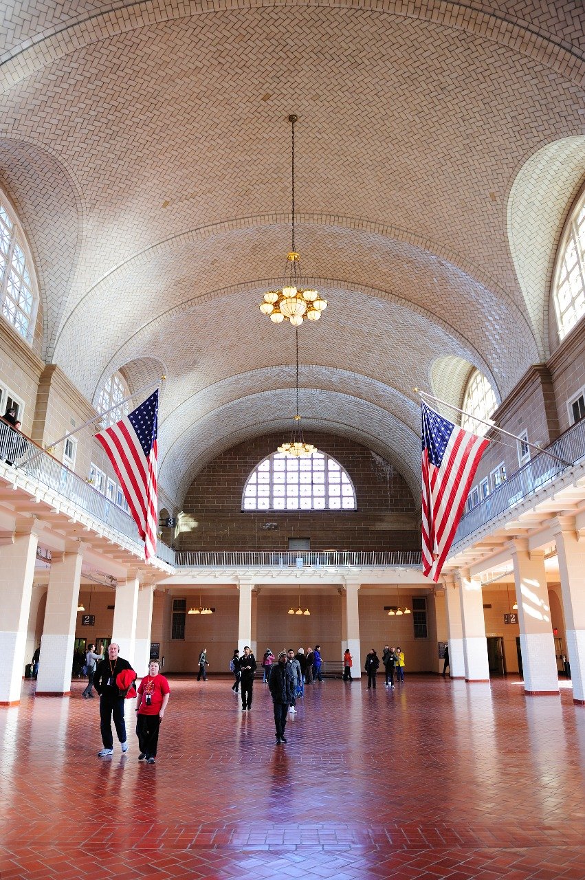 Government hall with American flags representing immigration policy and reform discussions